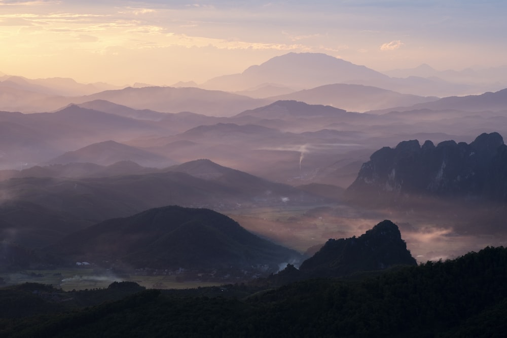 a view of a valley with mountains in the background