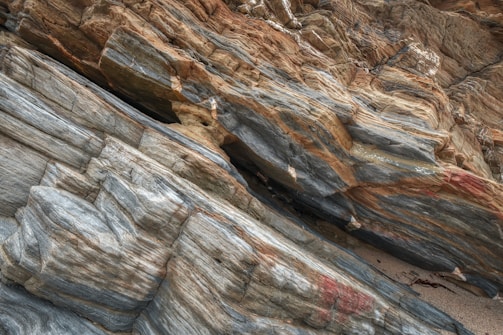 a bird is perched on a rock formation