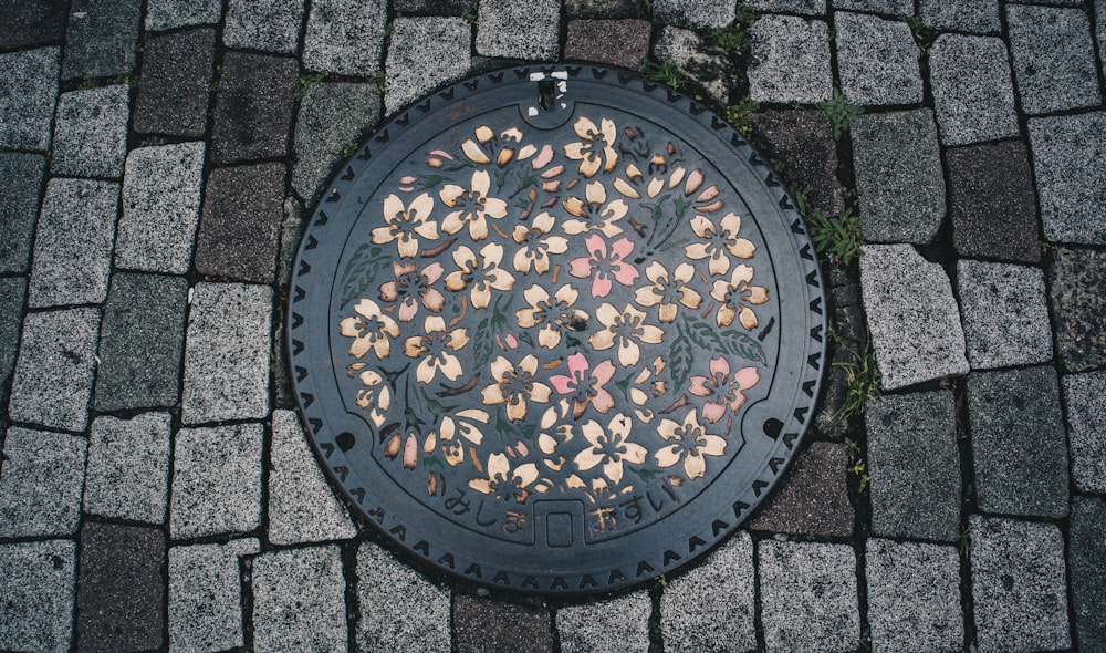 a manhole cover with a bunch of nuts on it