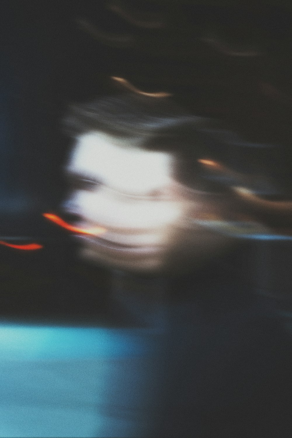 a blurry photo of a man's face with a blurry background