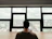 Photo of a professional man reviewing documents at a desk with a window view of the Willamette Valley.