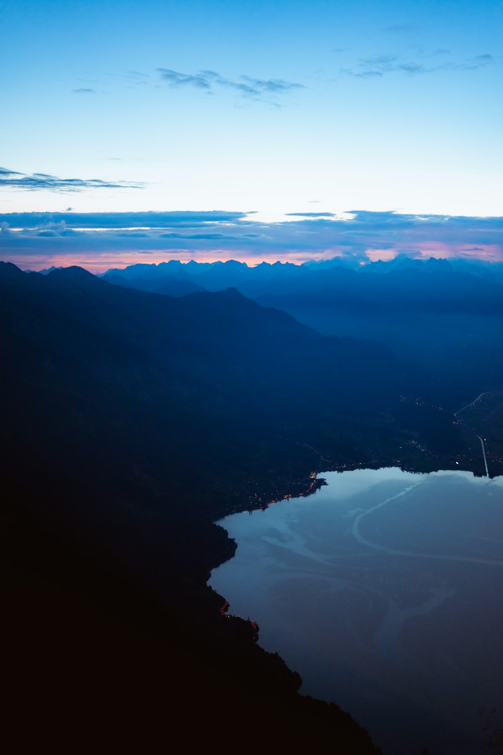 a view of a lake and mountains from a plane