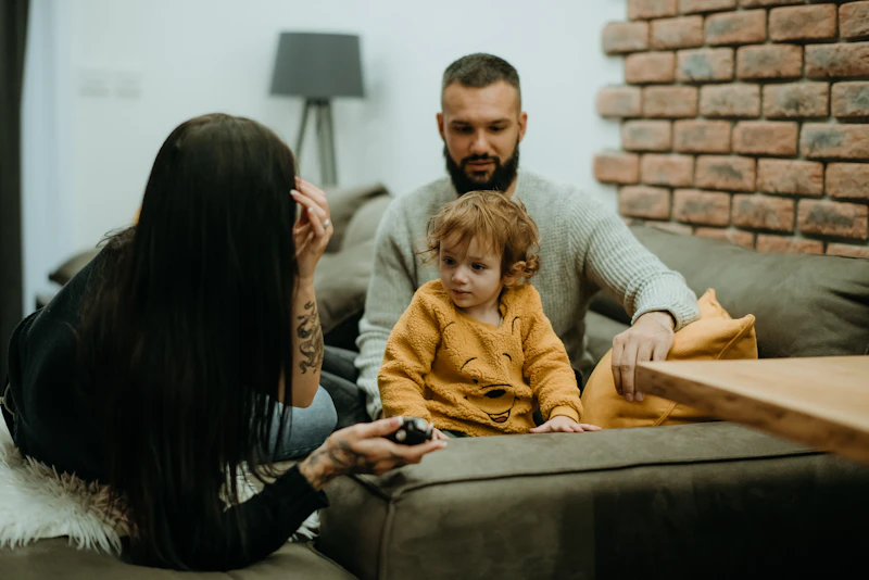 Father and daughter relaxing together at home — clean healthy air