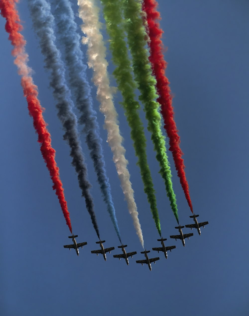 a group of airplanes flying in formation in the sky