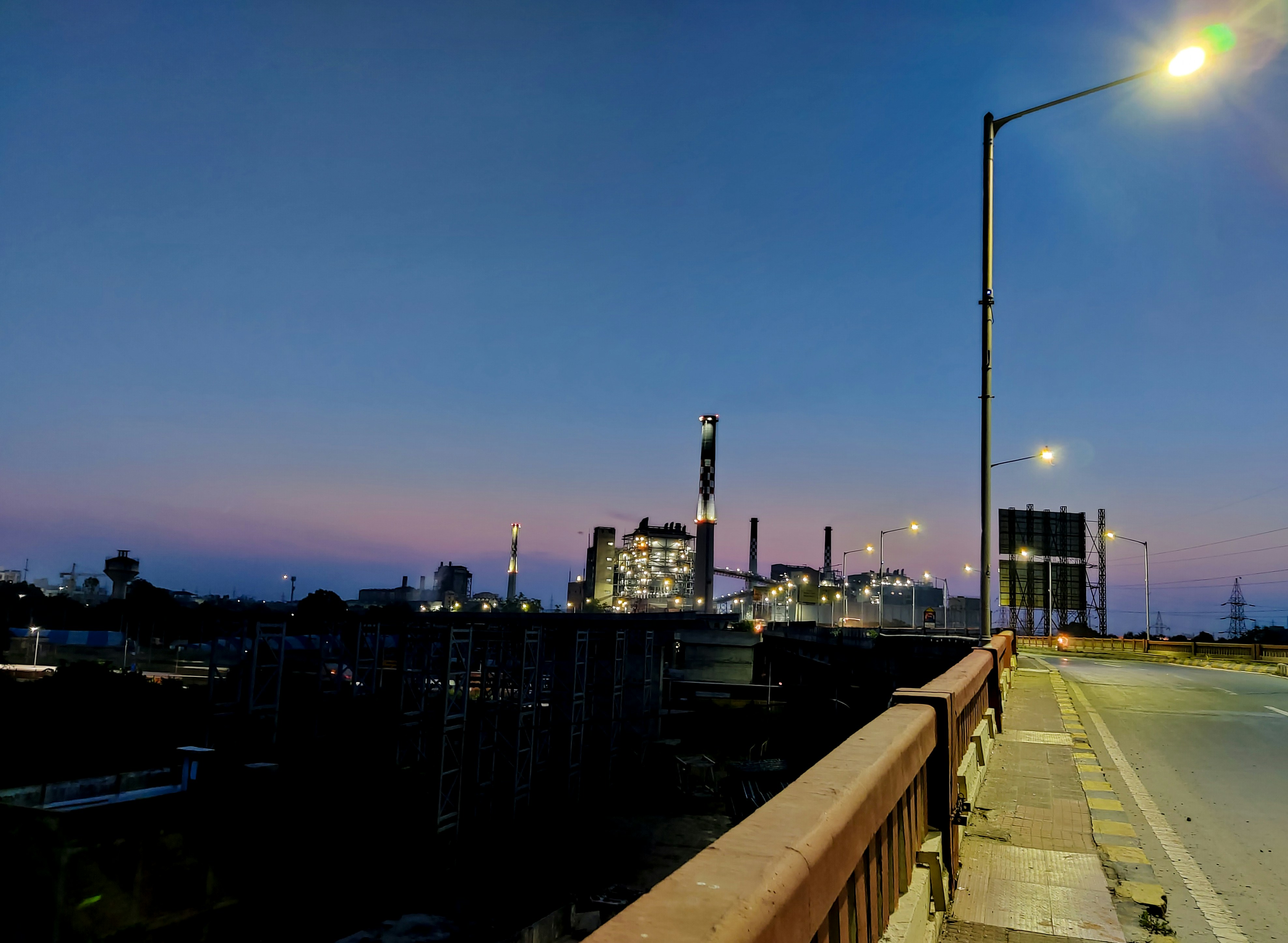 Evening view of the industrial zone with illuminated buildings