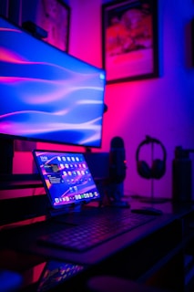a laptop computer sitting on top of a desk