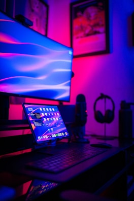a laptop computer sitting on top of a desk