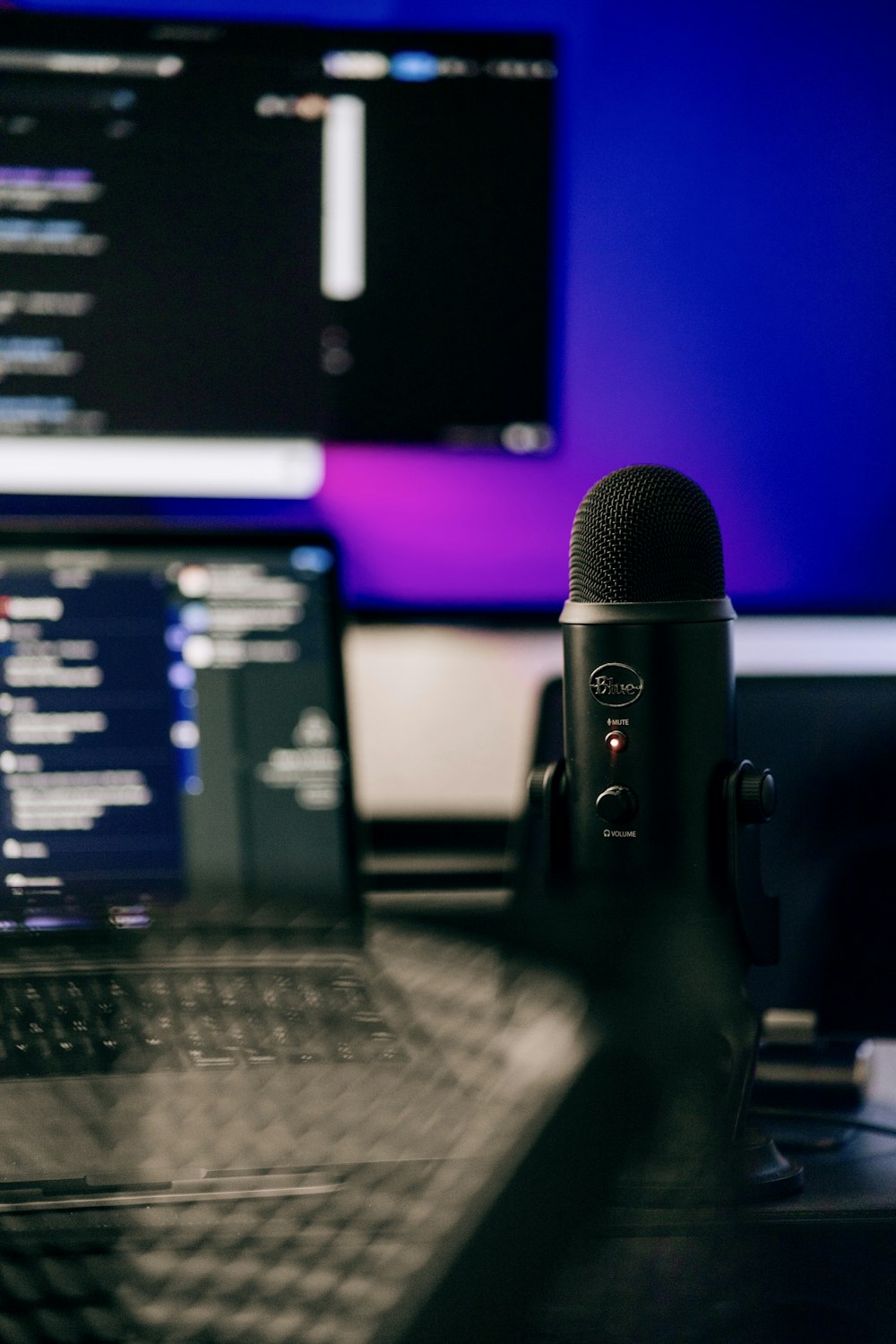 a microphone sitting next to a laptop computer