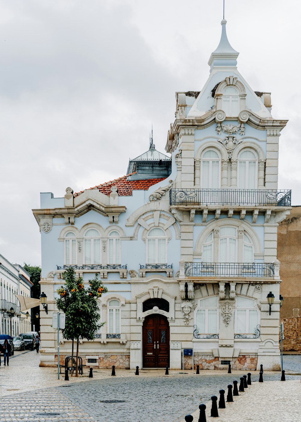 a large white building with a clock tower on top of it