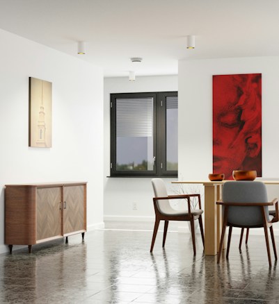 A modern interior space featuring a dining area with a light wooden table and two gray upholstered chairs. The floor is made of reflective dark tiles. On one wall, there is a wooden cabinet with a herringbone pattern, and above it hangs an artwork with a soft beige tone depicting a tower. Adjacent to the table on another wall, a bold red and black abstract painting adds a striking contrast. The room is illuminated by natural light coming through a large window with closed blinds.