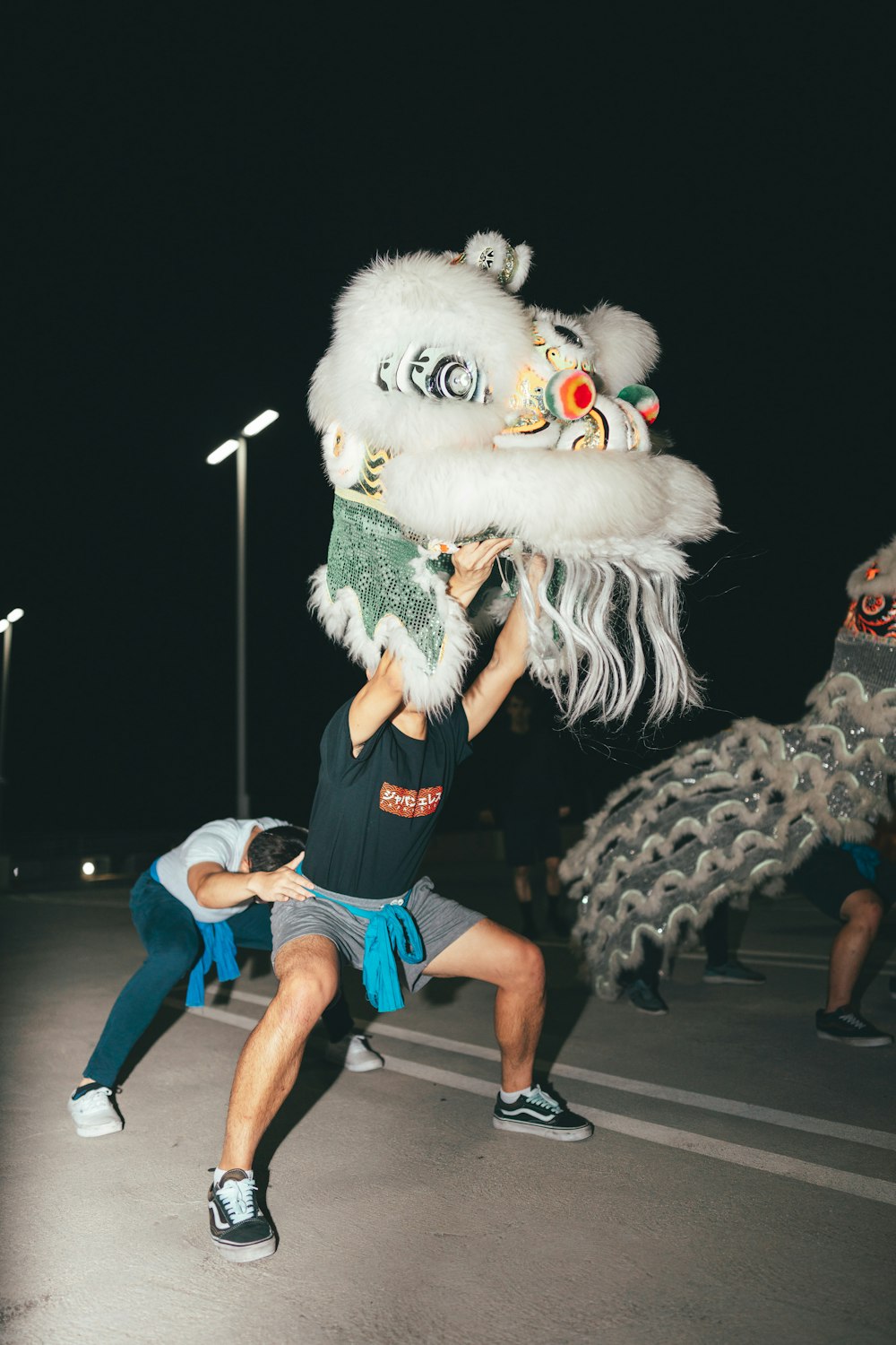 a man in a lion costume is dancing with a woman