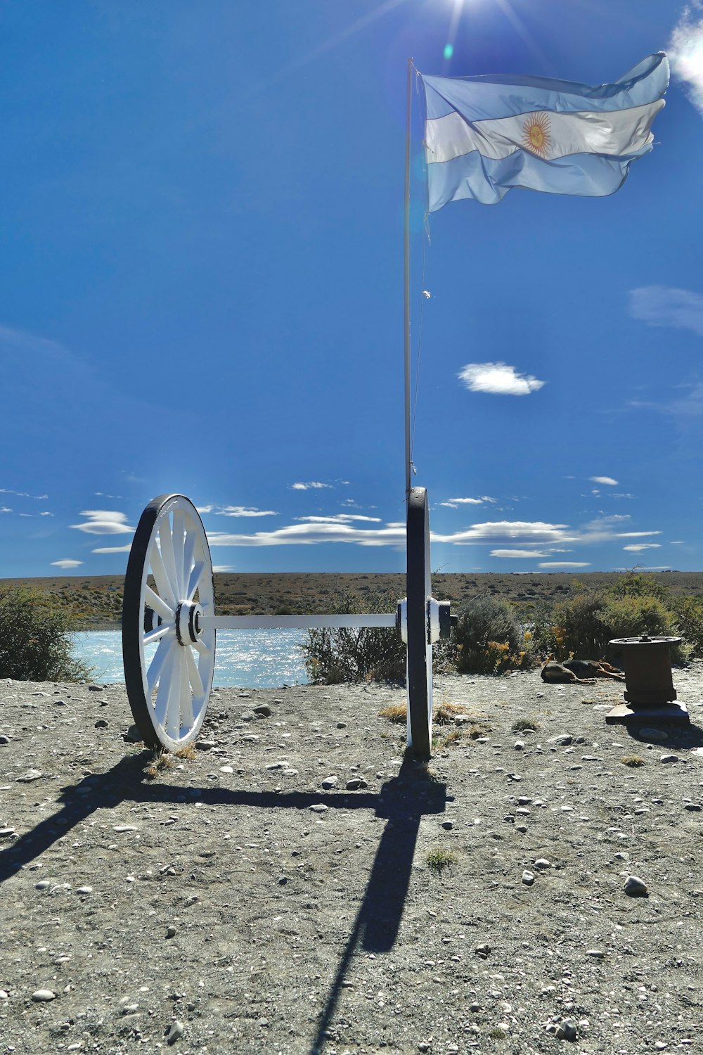 a flag is flying next to a wheel