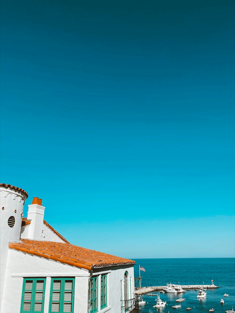 a view of the ocean from a roof of a building