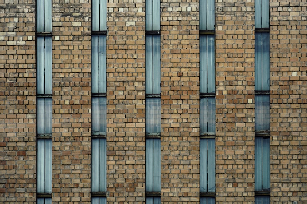 a large brick building with a clock on it's side