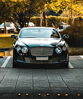 a black car parked in a parking lot