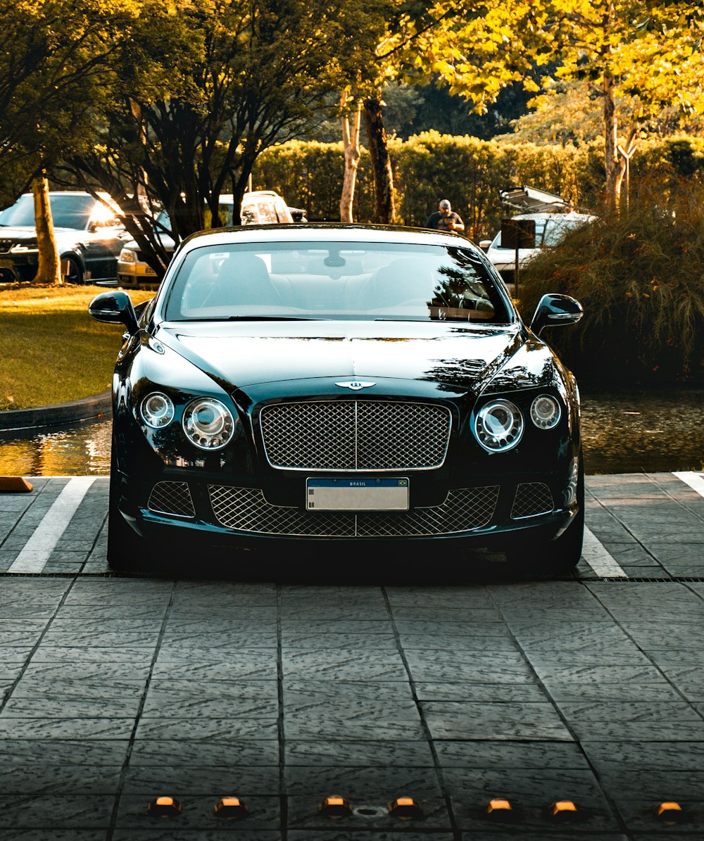 a black car parked in a parking lot