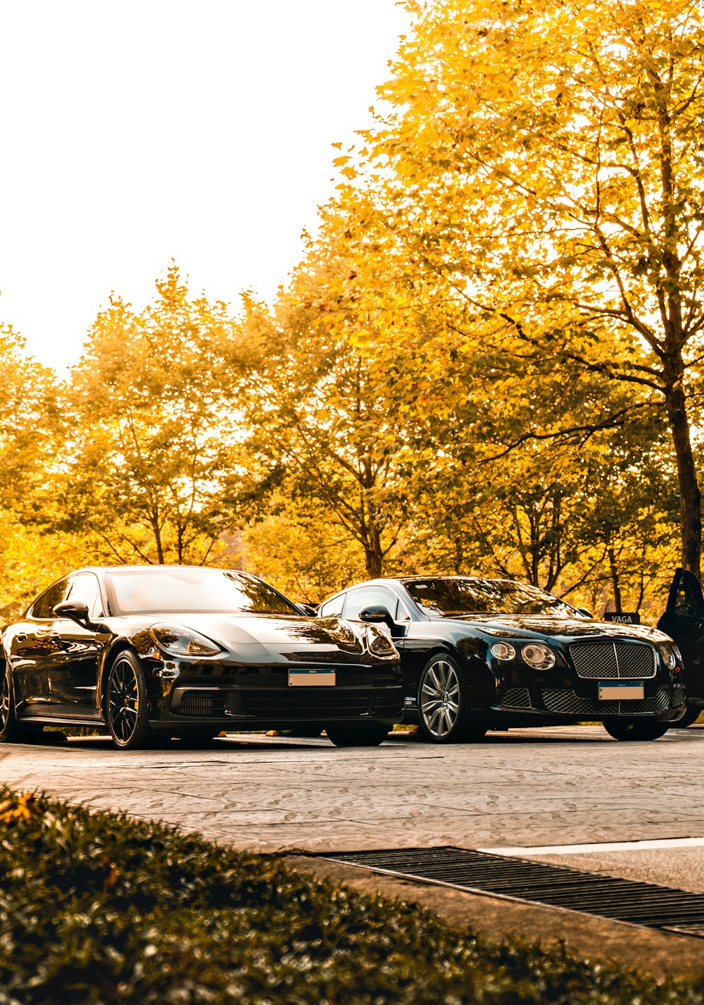 a group of cars parked next to each other on a street