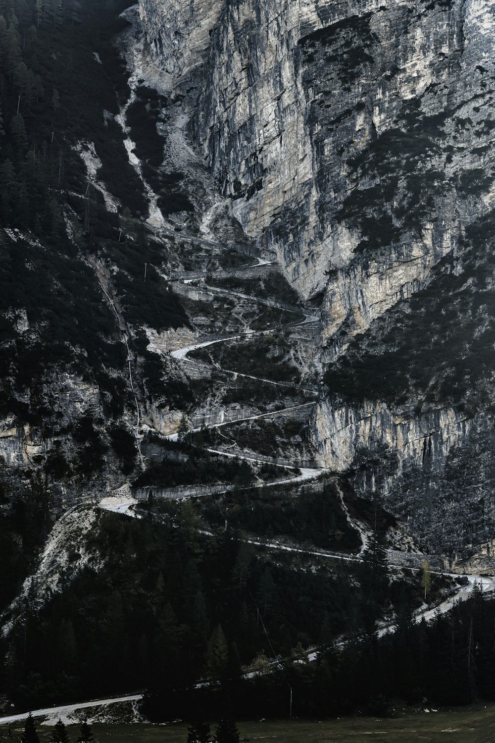 a black and white photo of a mountain side