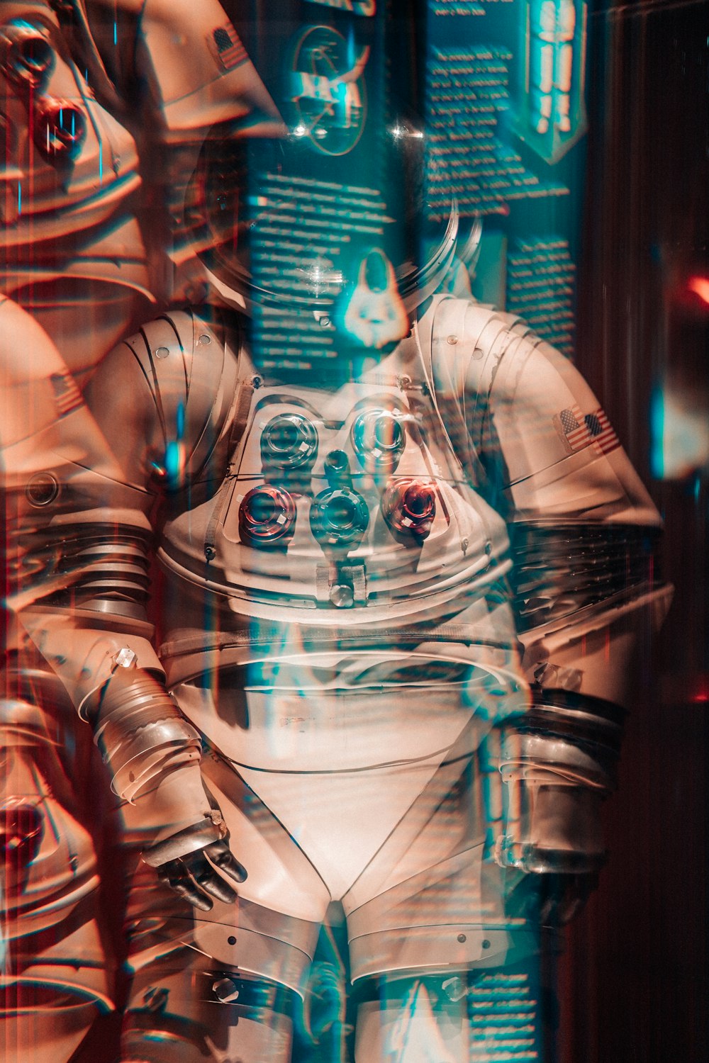 a man in a space suit standing in front of a window