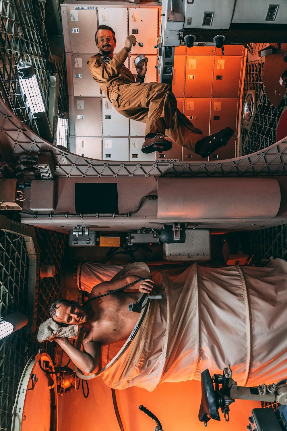 a man laying on top of a bed in a room