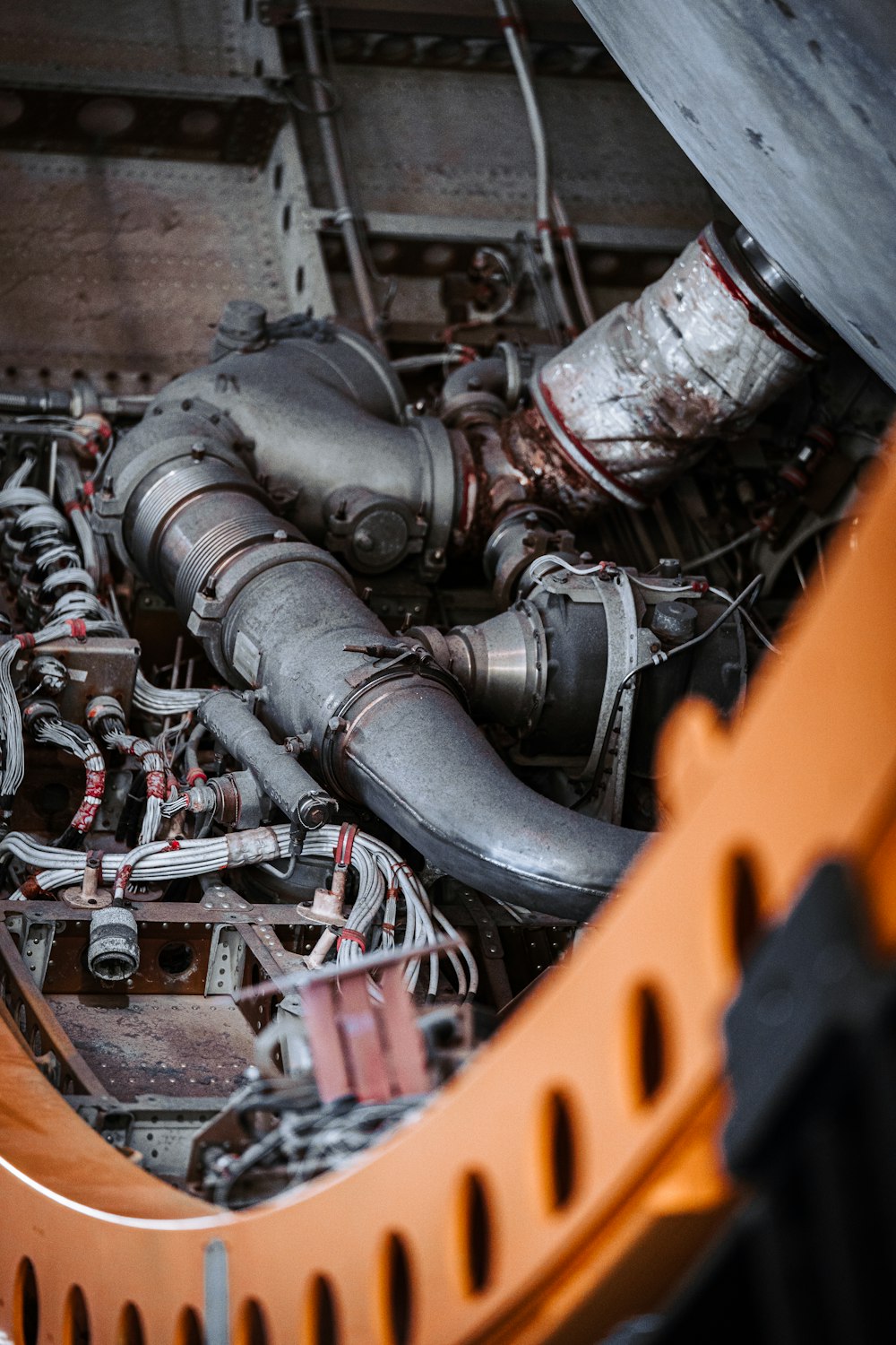 a close up of a car engine with many pipes