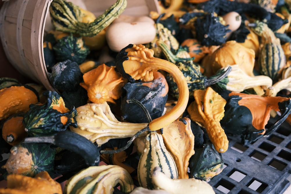 a pile of fake gourds sitting on top of a table