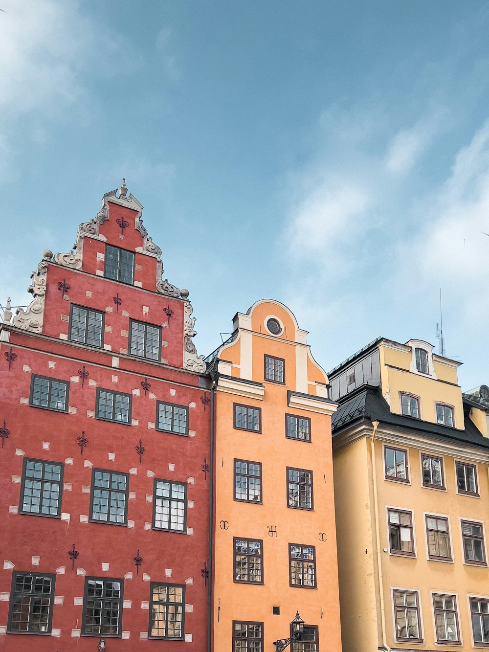 a row of buildings with a clock tower on top