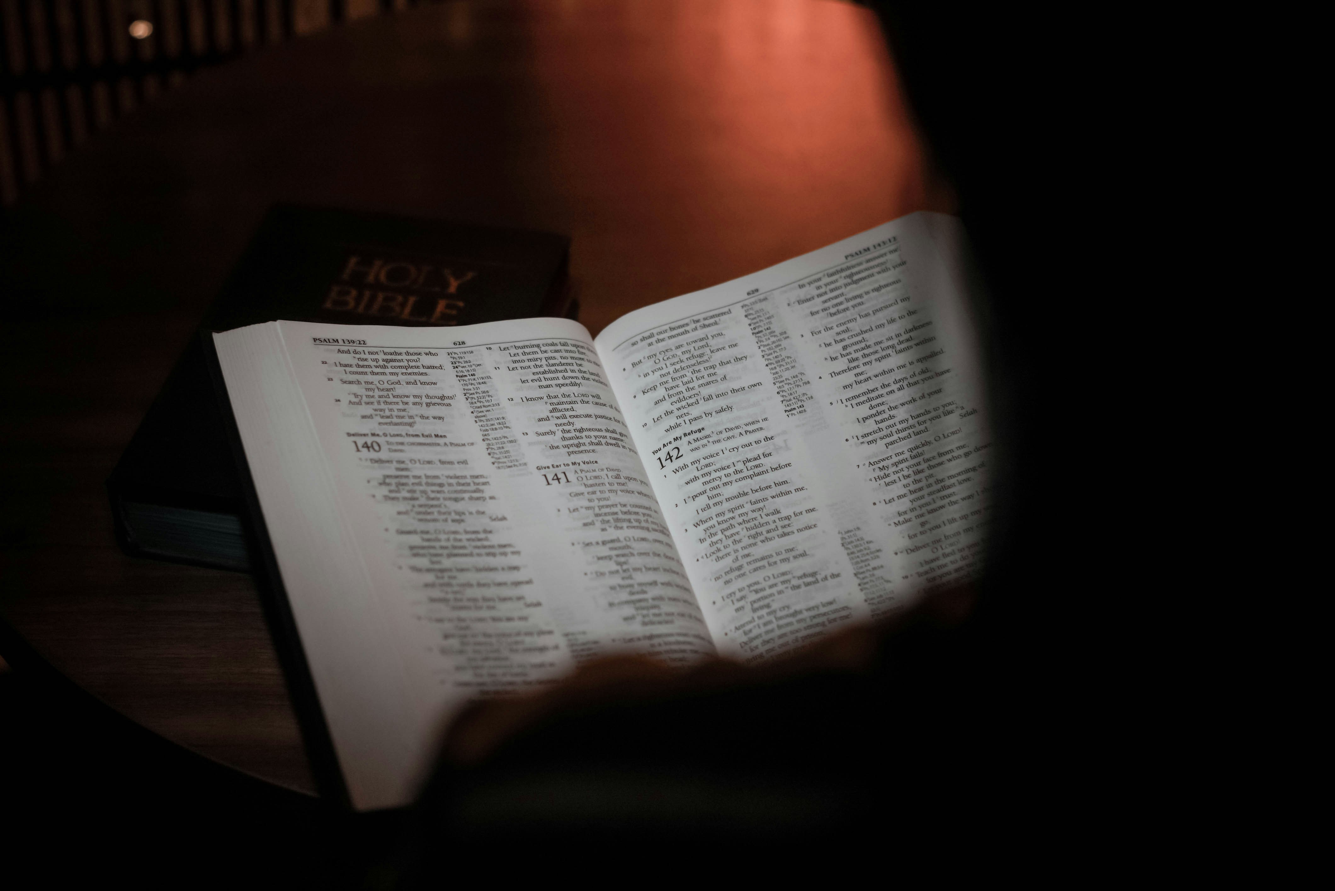 a person reading a book on a table