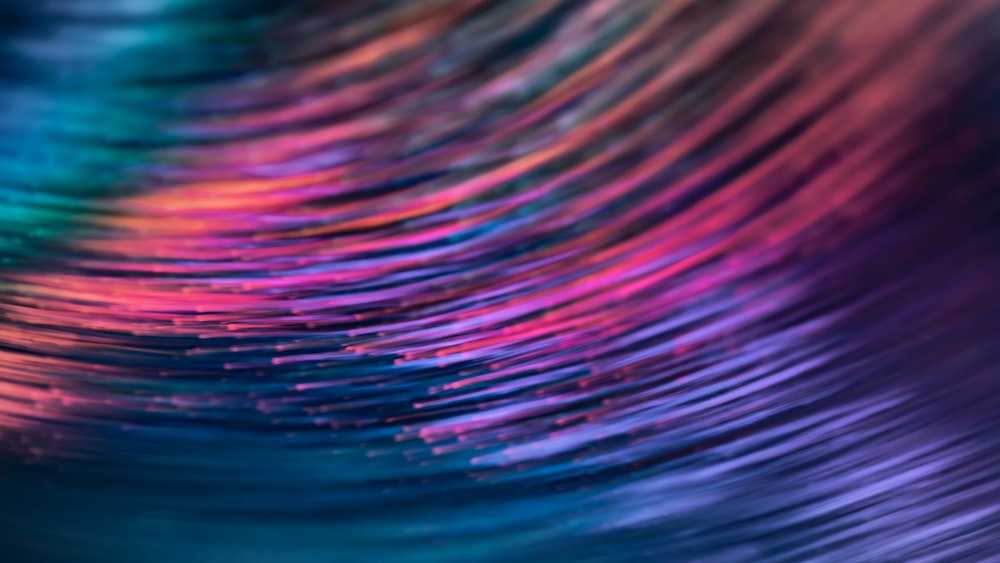 a blurry image of a colorful wave