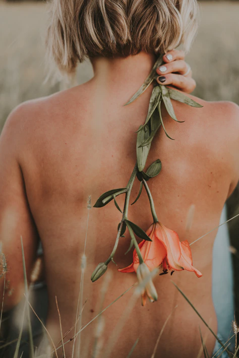 a person with a flower in their back