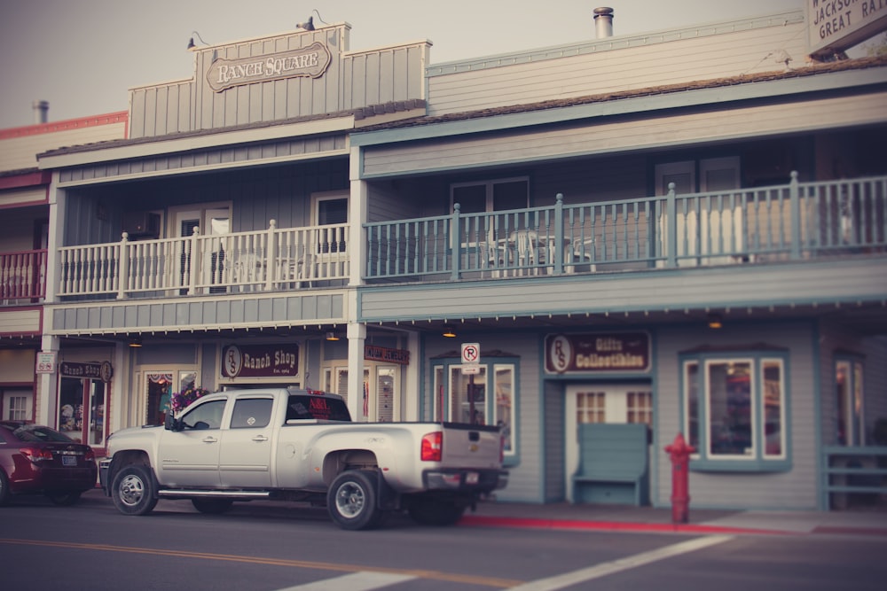 a truck is parked in front of a building