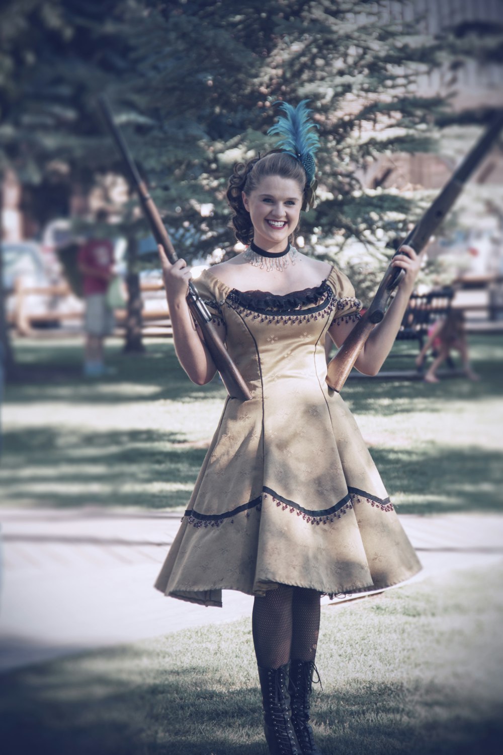 a woman in a dress holding a baseball bat