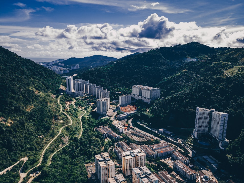 an aerial view of a city in the mountains