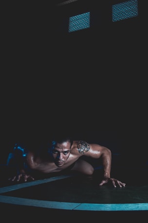 a man is doing push ups on a mat