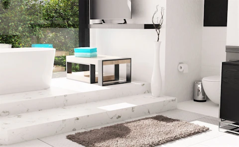 a bathroom with a toilet, sink, and bathtub