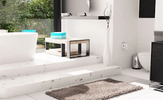 a bathroom with a toilet, sink, and bathtub