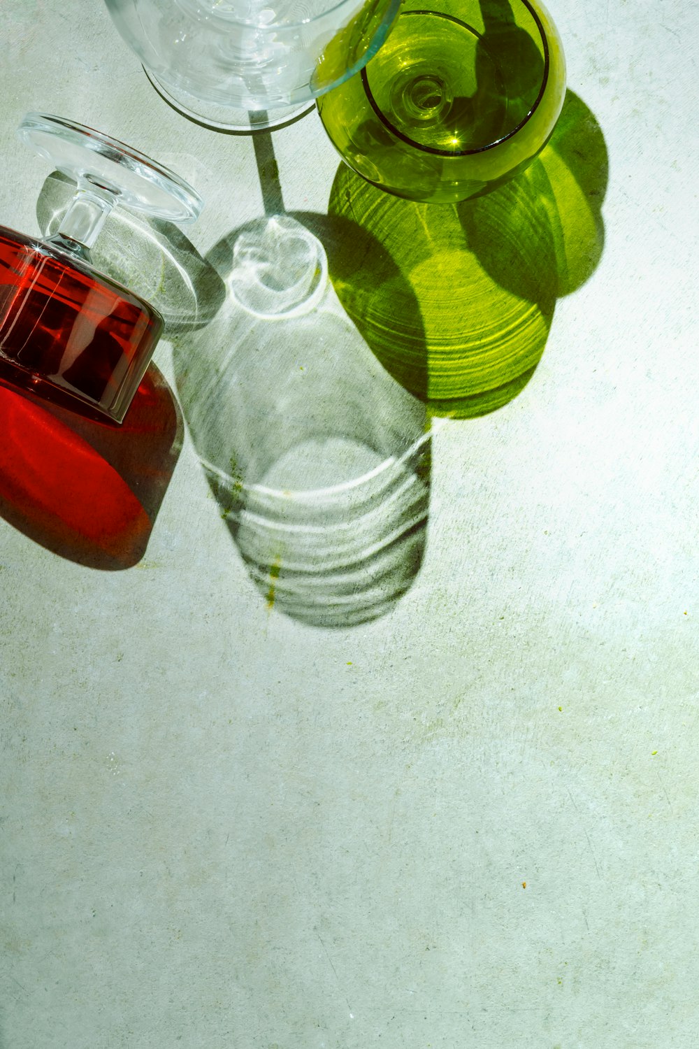 a group of glass vases sitting on top of a table