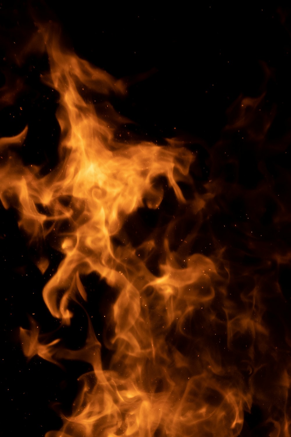 a close up of a fire on a black background