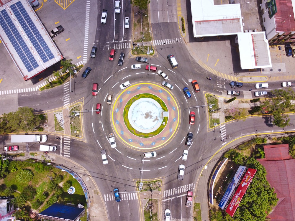 an aerial view of a city intersection with cars