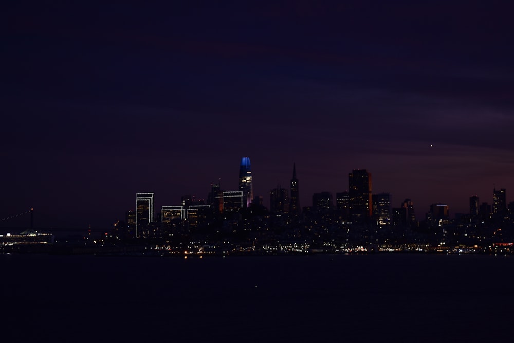 a view of a city at night from across the water