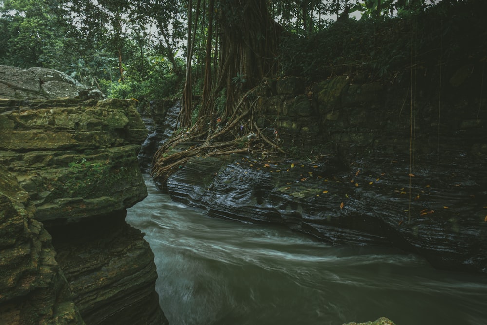 a large waterfall over a body of water