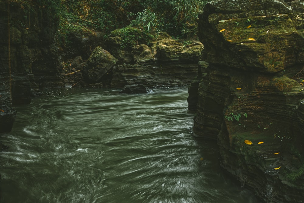 a large waterfall over a body of water