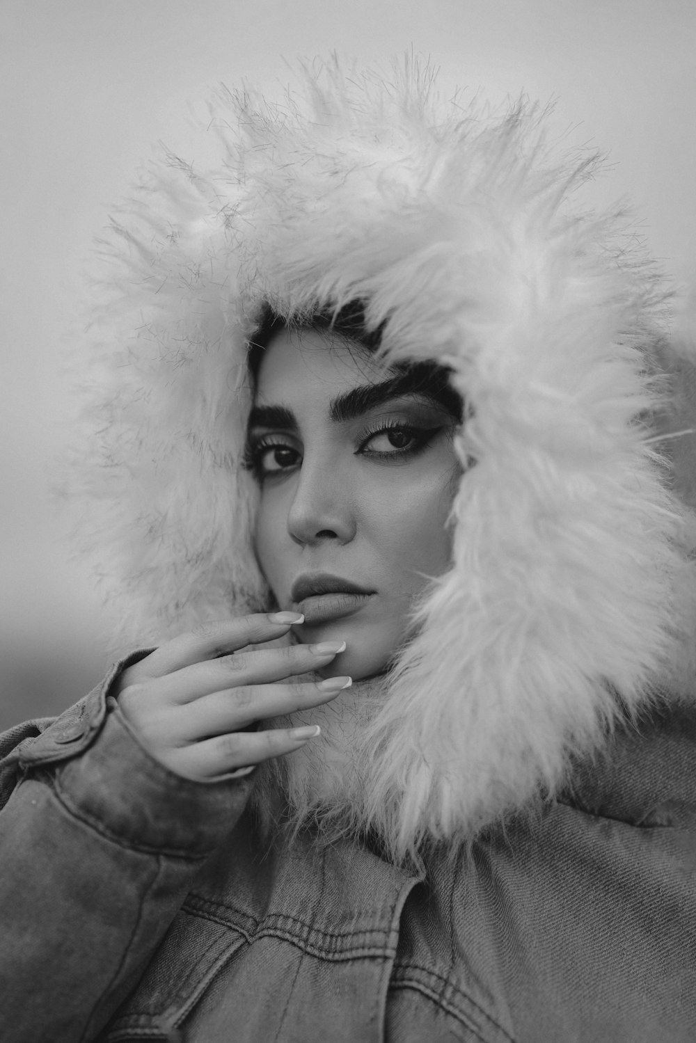 a woman wearing a fur hat and jacket