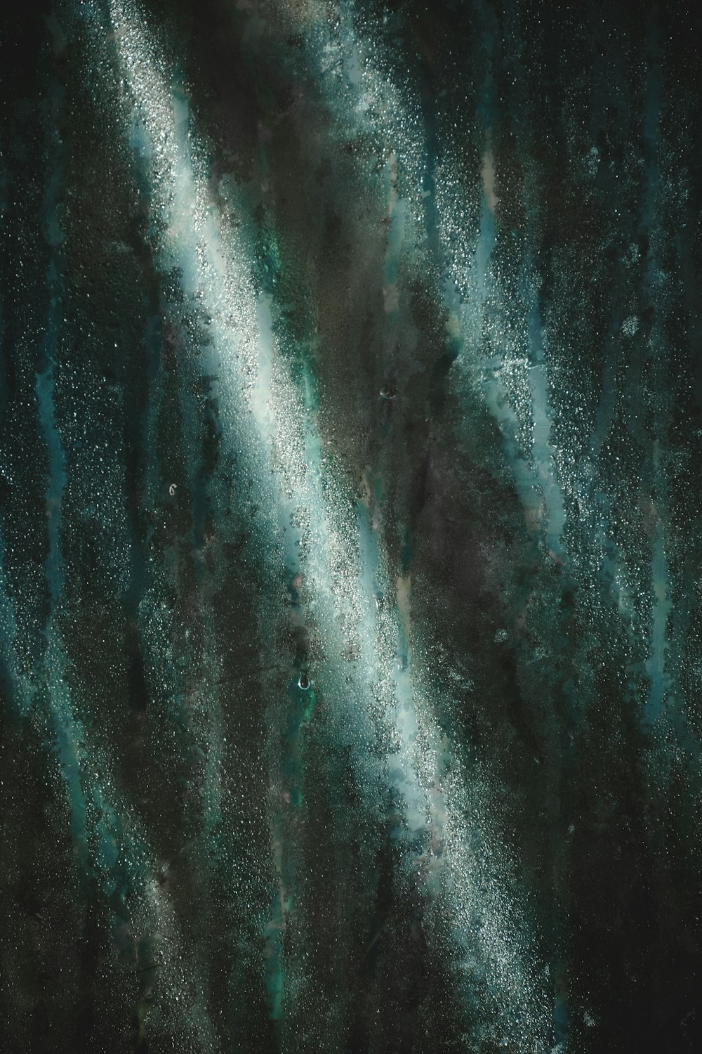 a painting of a black and green background