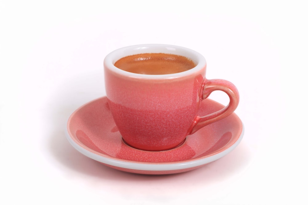 a cup of coffee is sitting on a saucer