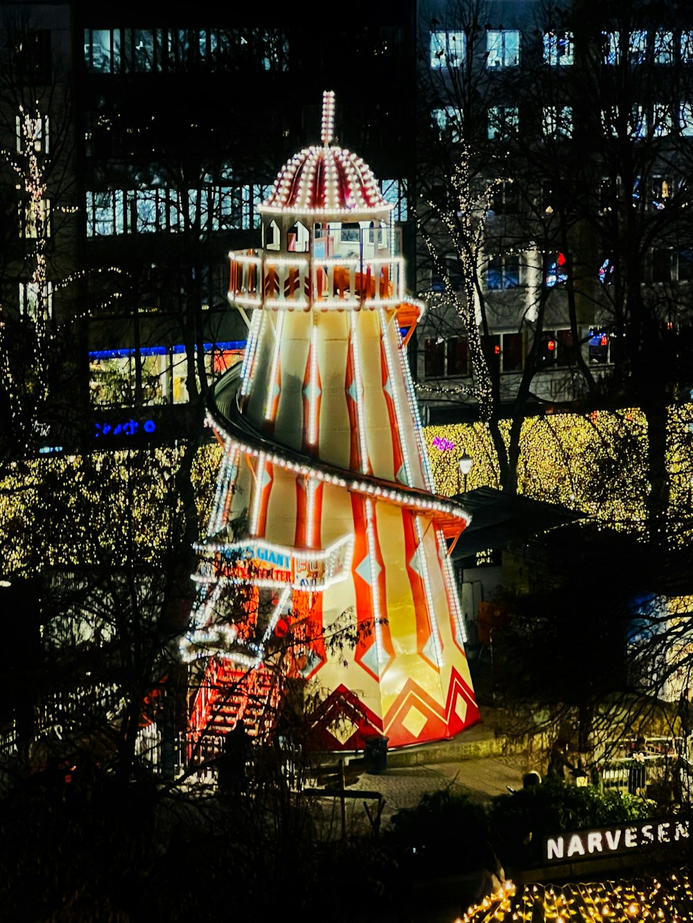 a carnival ride lit up at night in a park