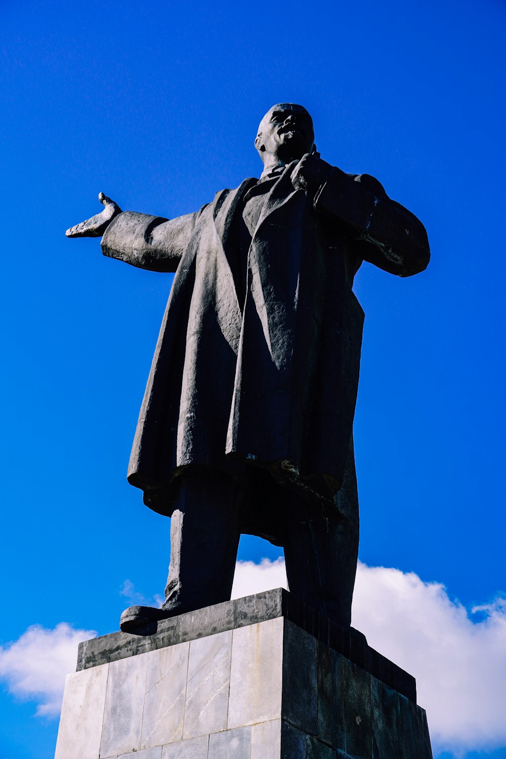 a statue of a man with his arms outstretched