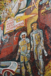 a mosaic of two astronauts standing next to each other