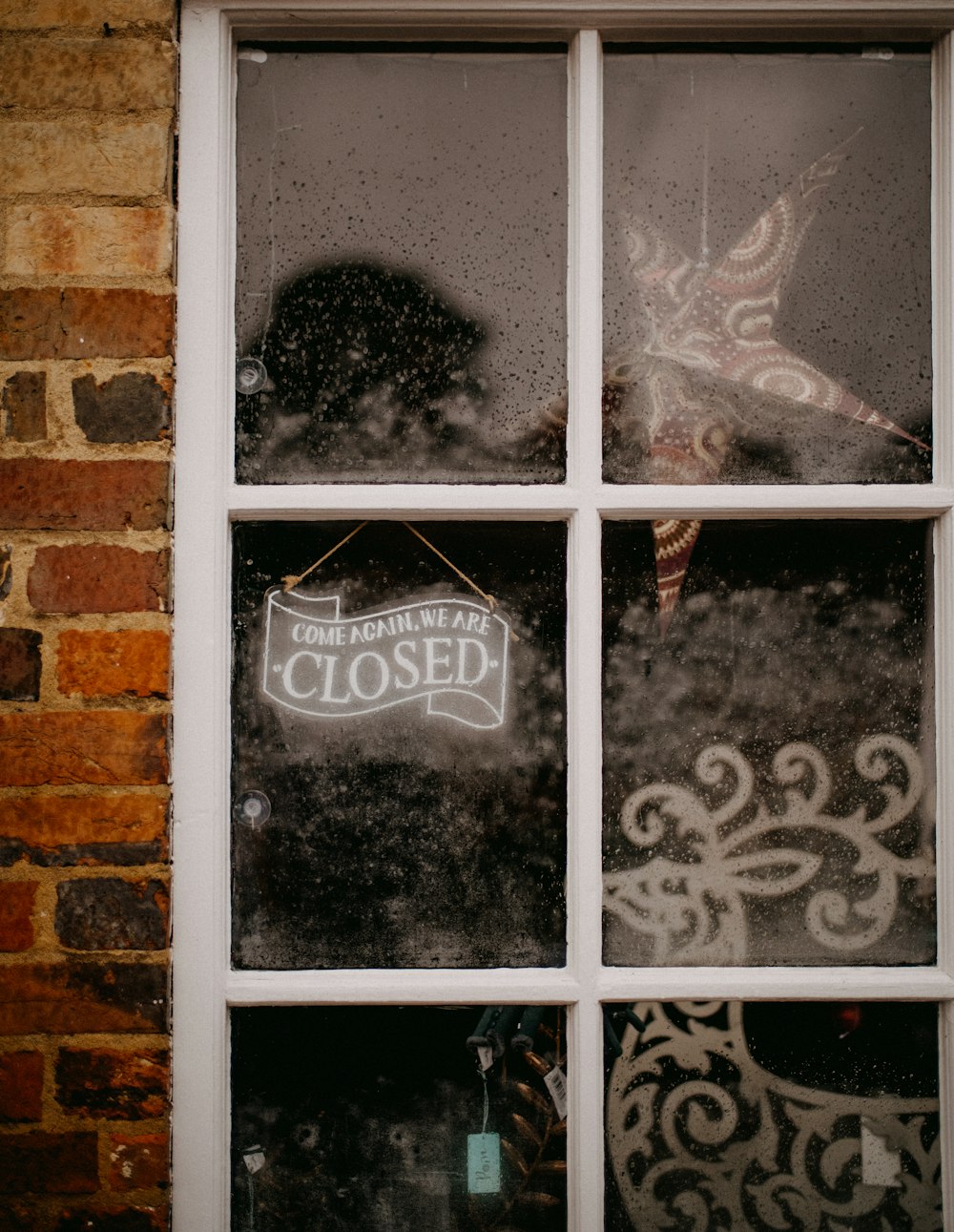 a close up of a window with a sign on it