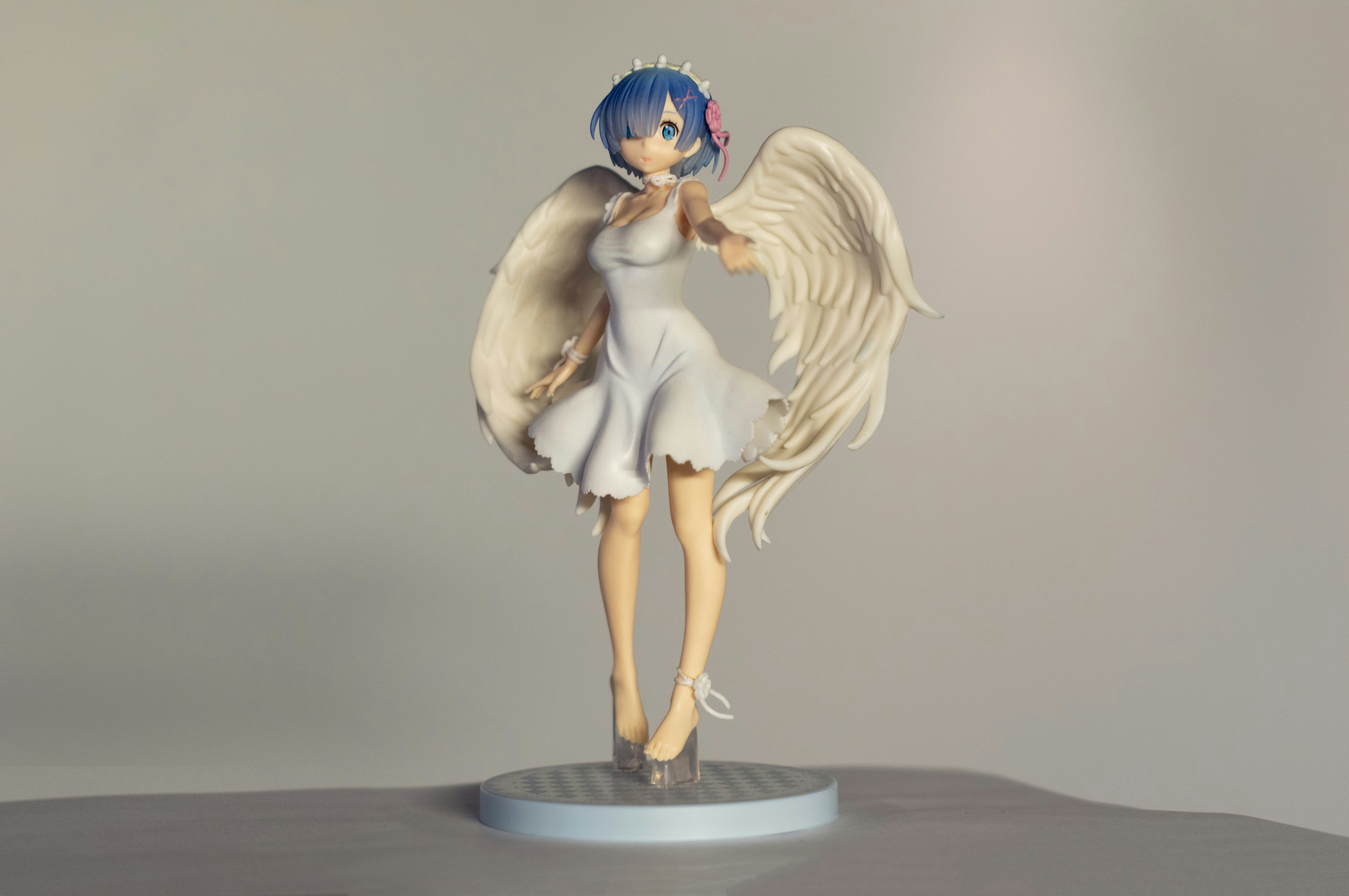 a figurine of a girl with wings on a table